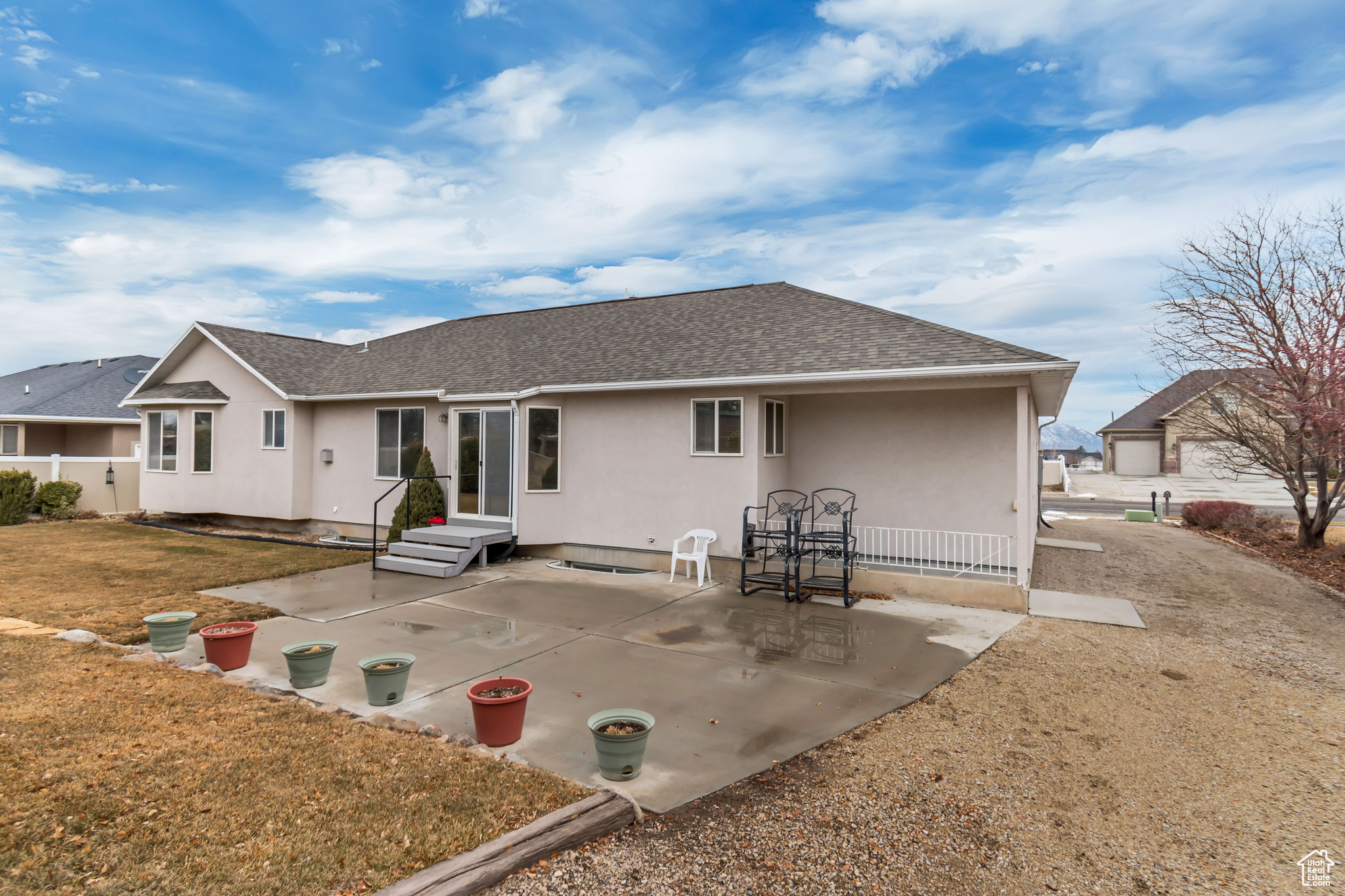 Rear view of house featuring a yard and a patio area