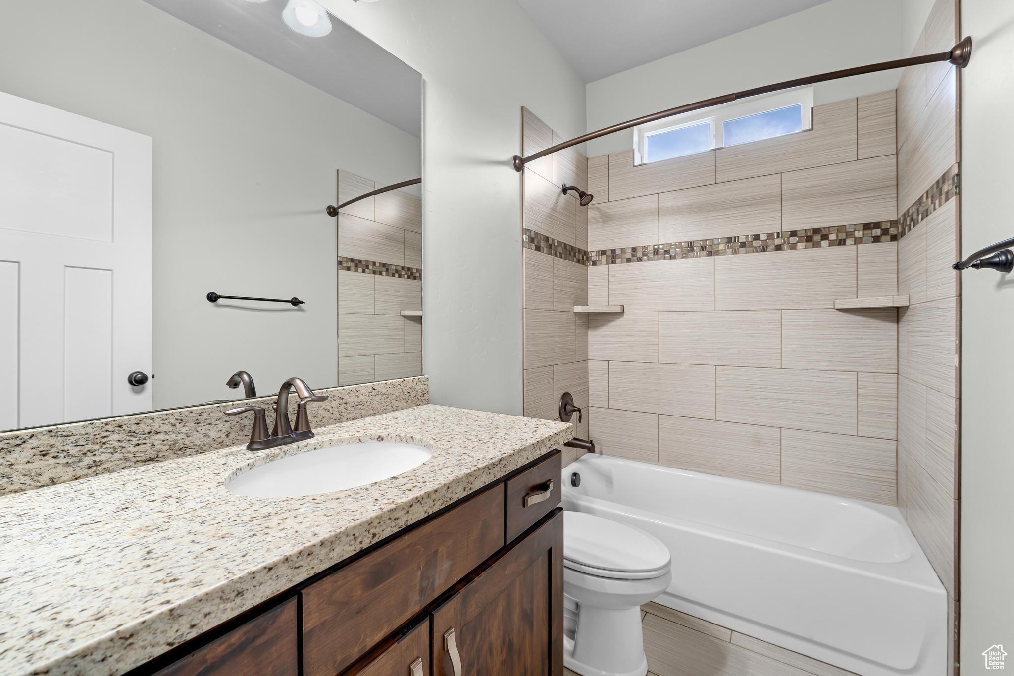 Fully tiled surround with decorative tile strip