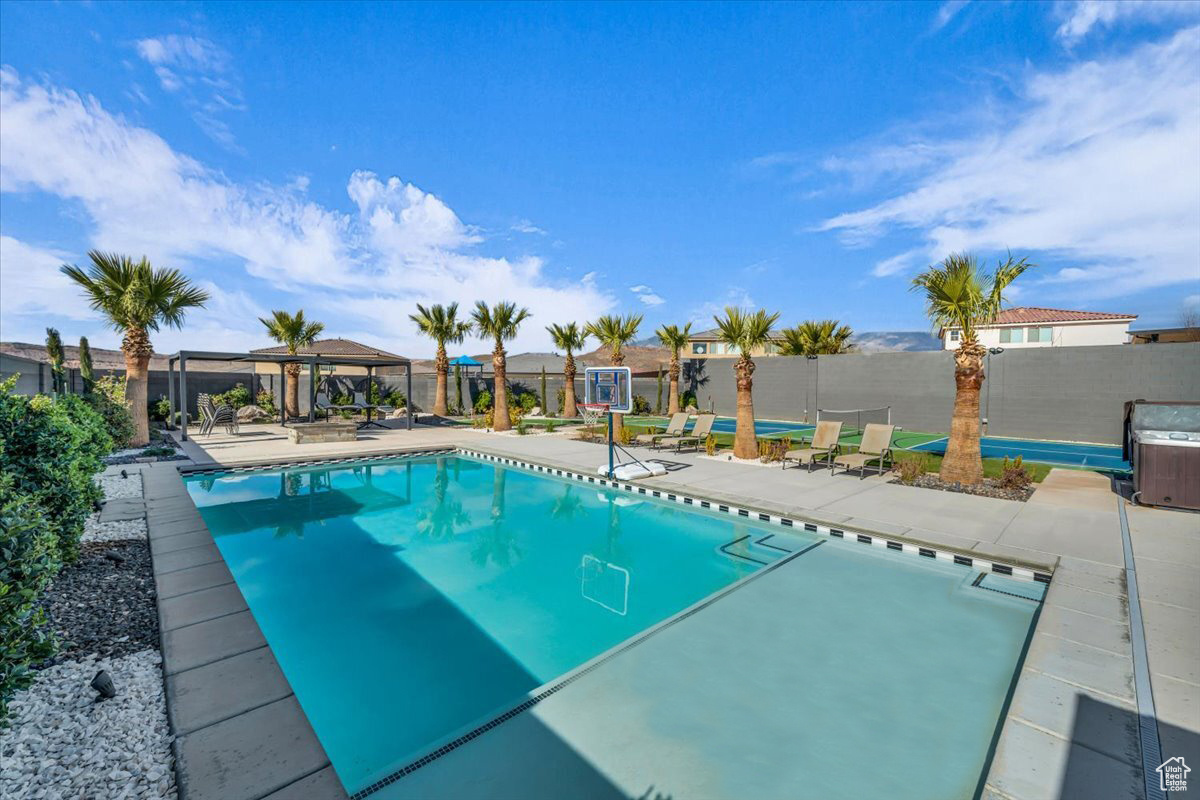 View of pool with a patio and a gazebo