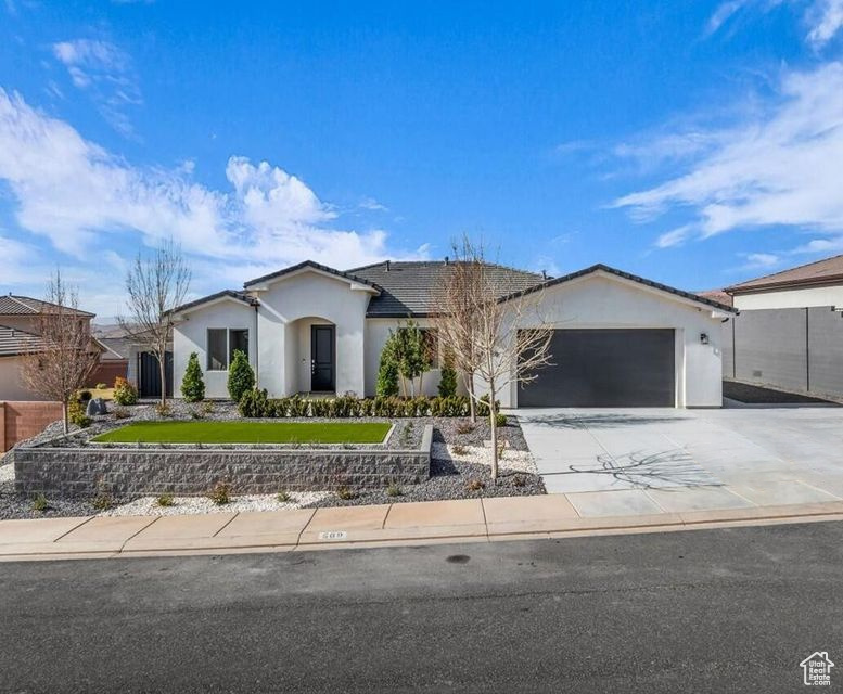 Ranch-style home featuring a garage