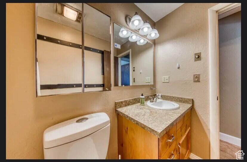 Bathroom with vanity and toilet