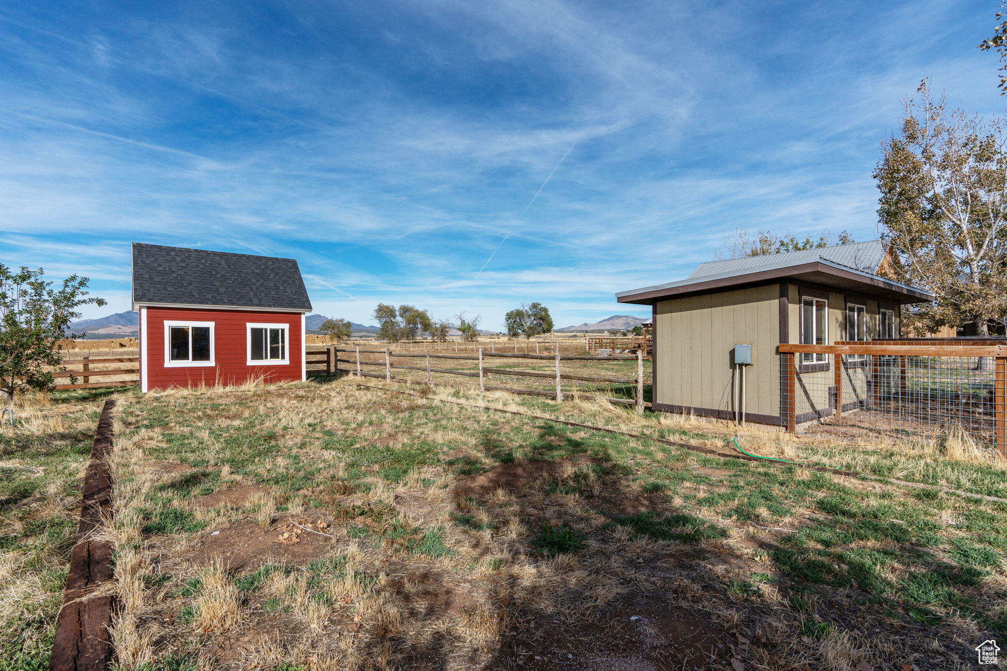 View of yard with a rural view and a shed