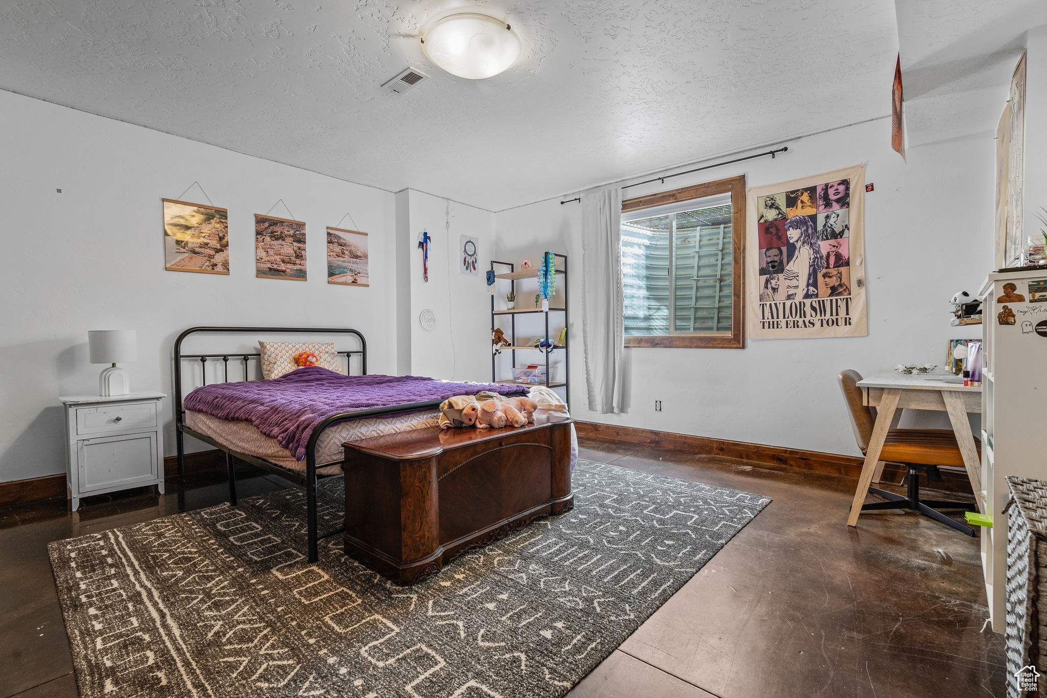 Bedroom with a textured ceiling