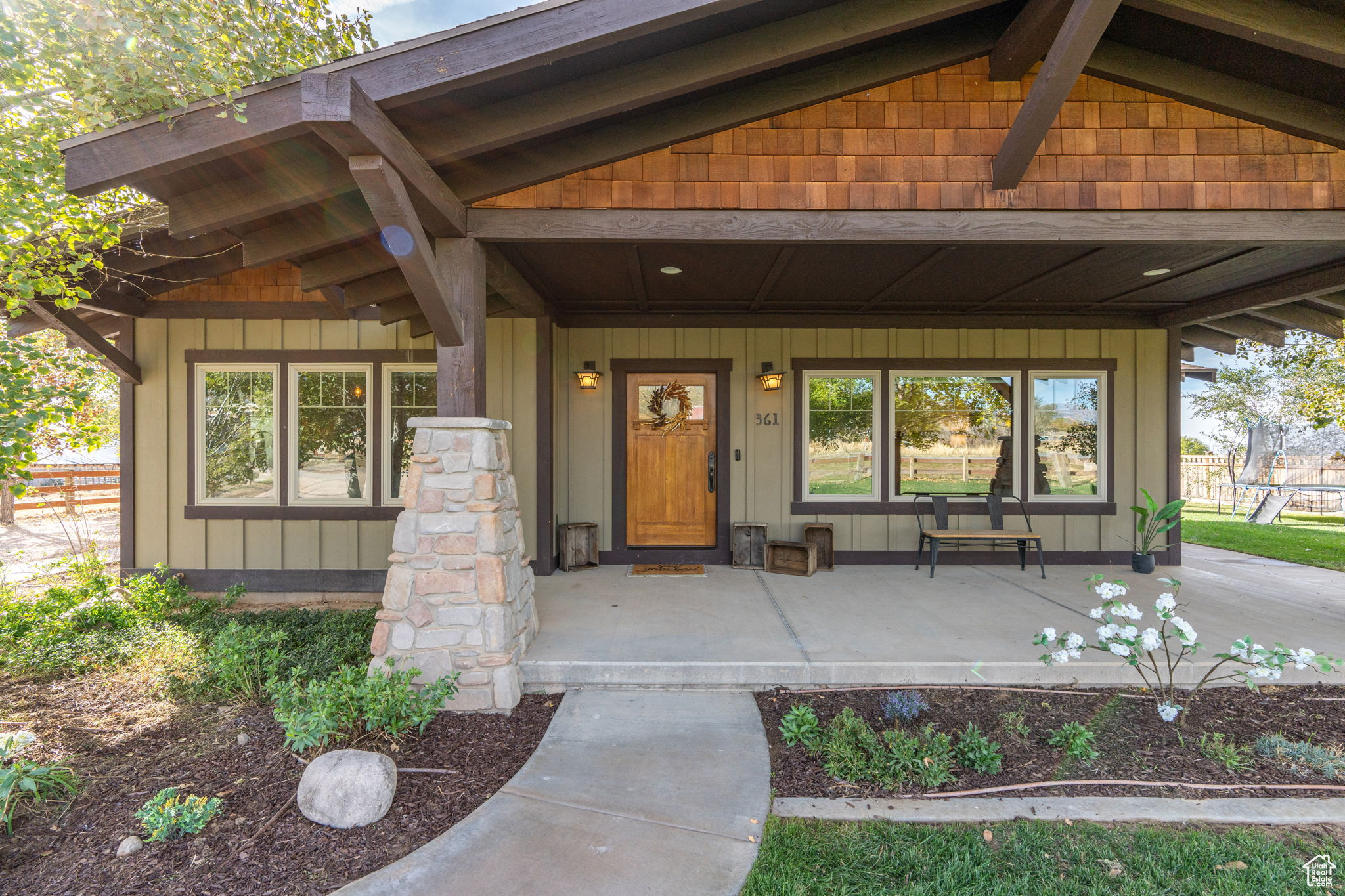View of exterior entry featuring a porch