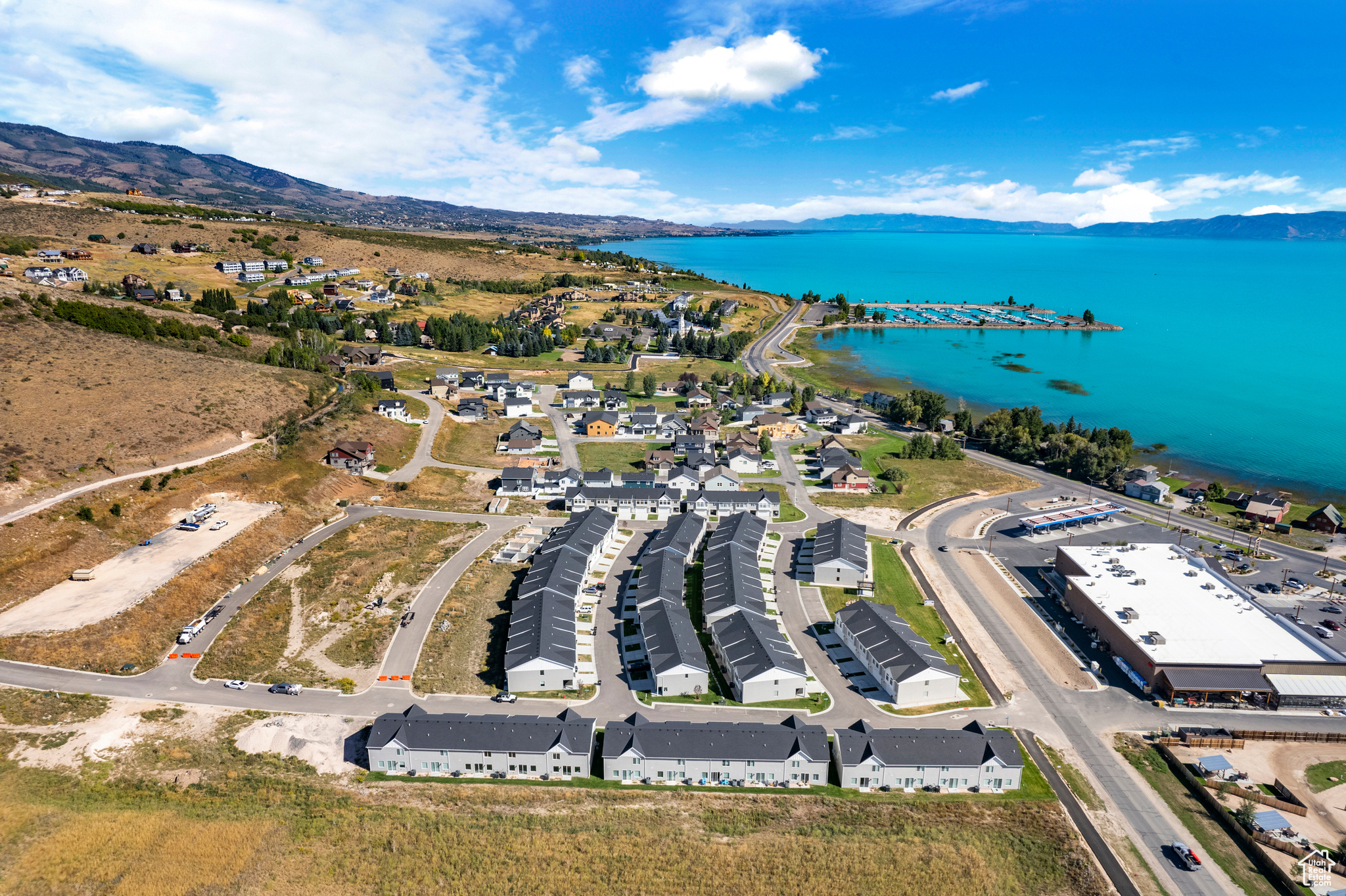 Aerial view featuring a water and mountain view