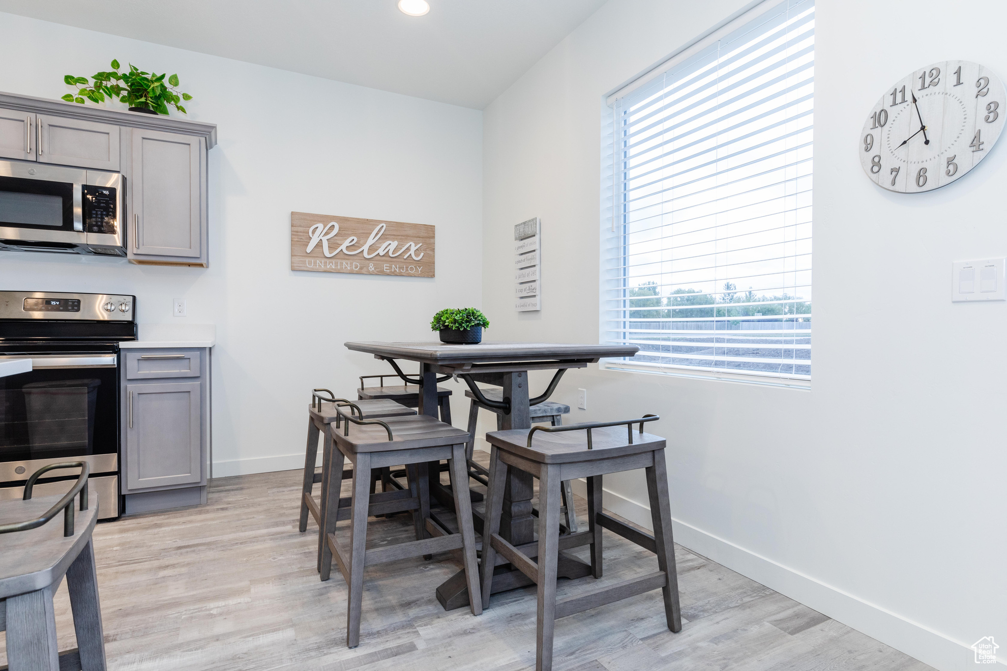 Dining area with light wood-type flooring