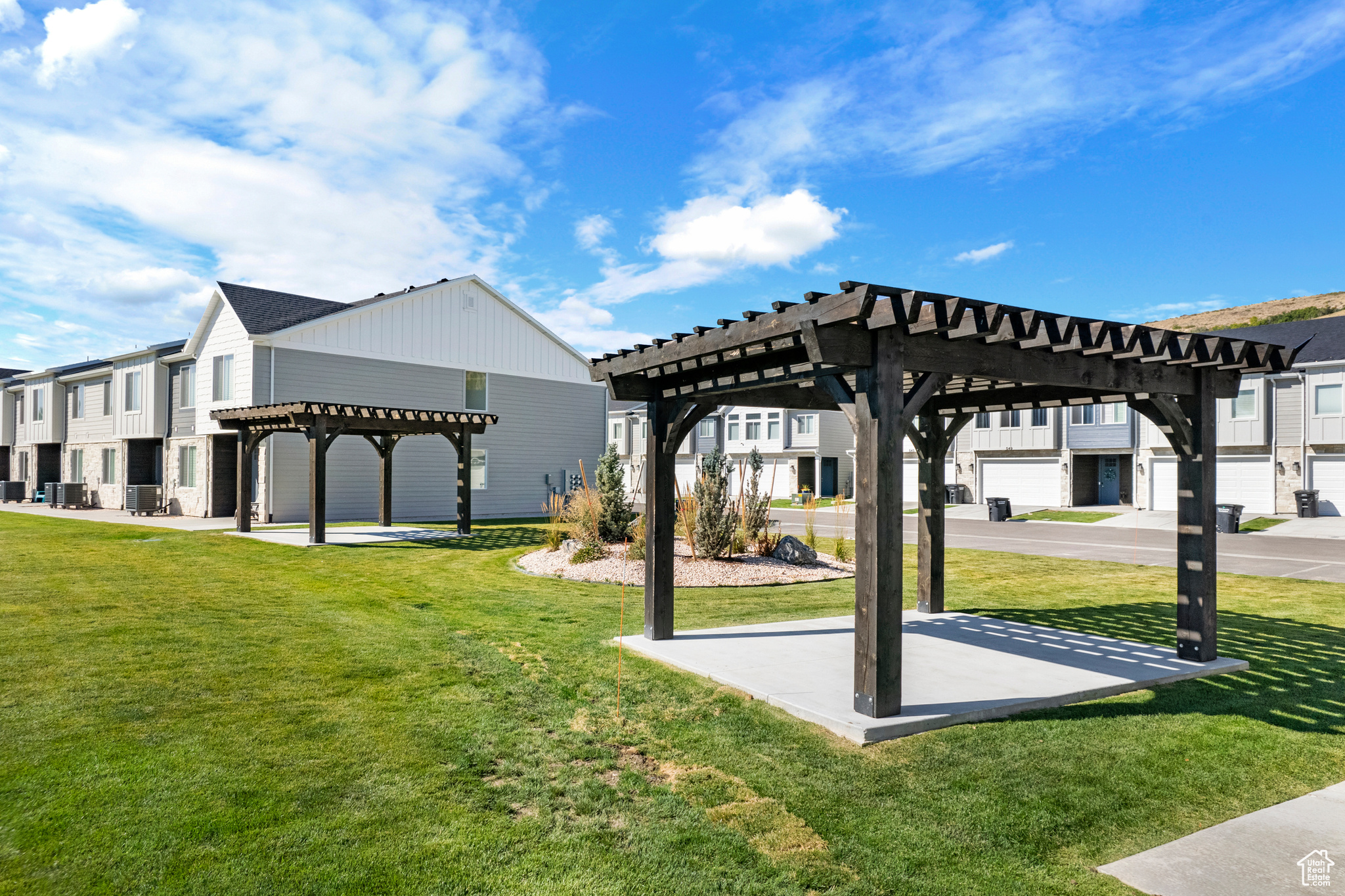 Surrounding community featuring a yard and a pergola