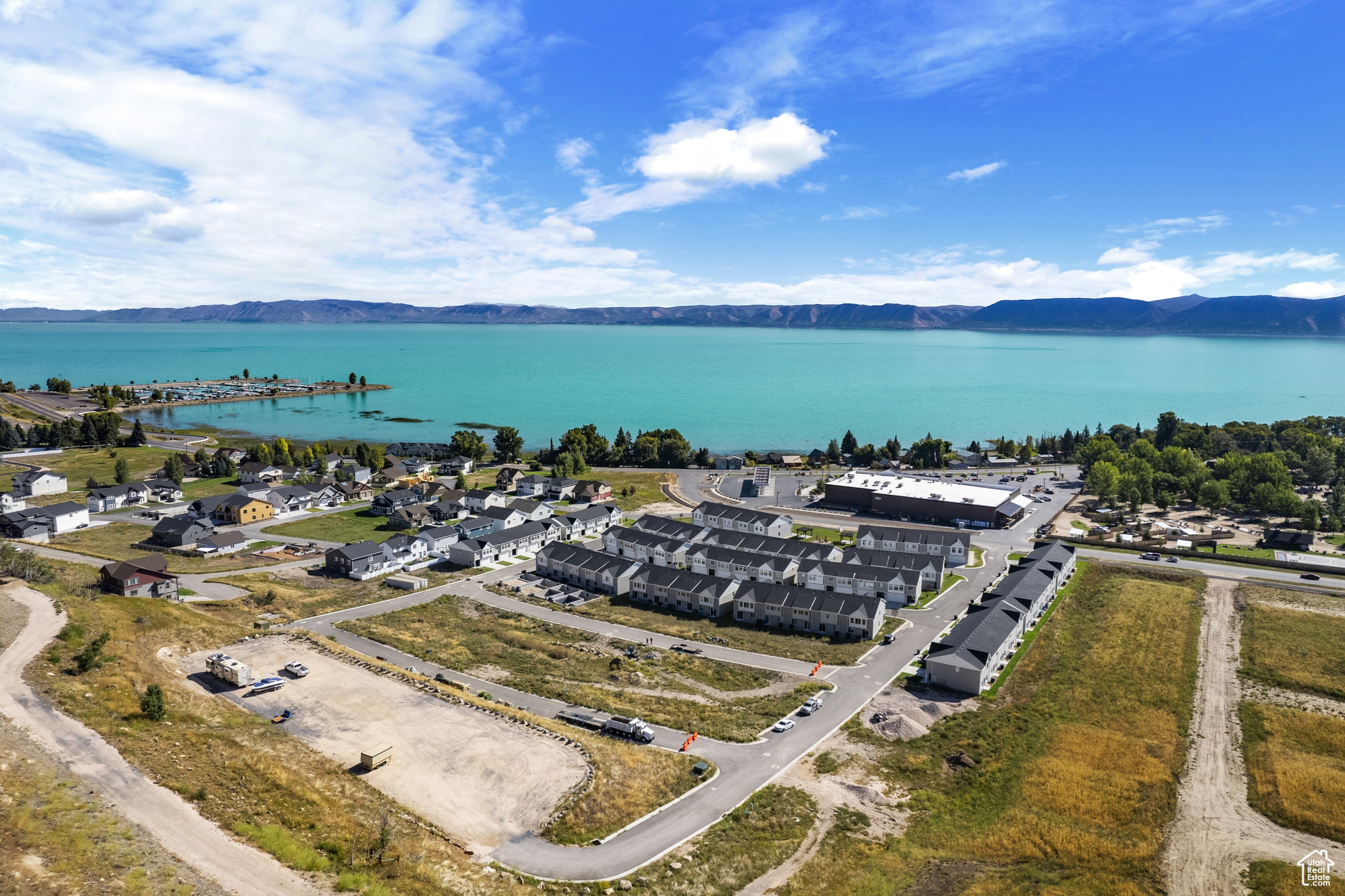 Drone / aerial view with a water and mountain view