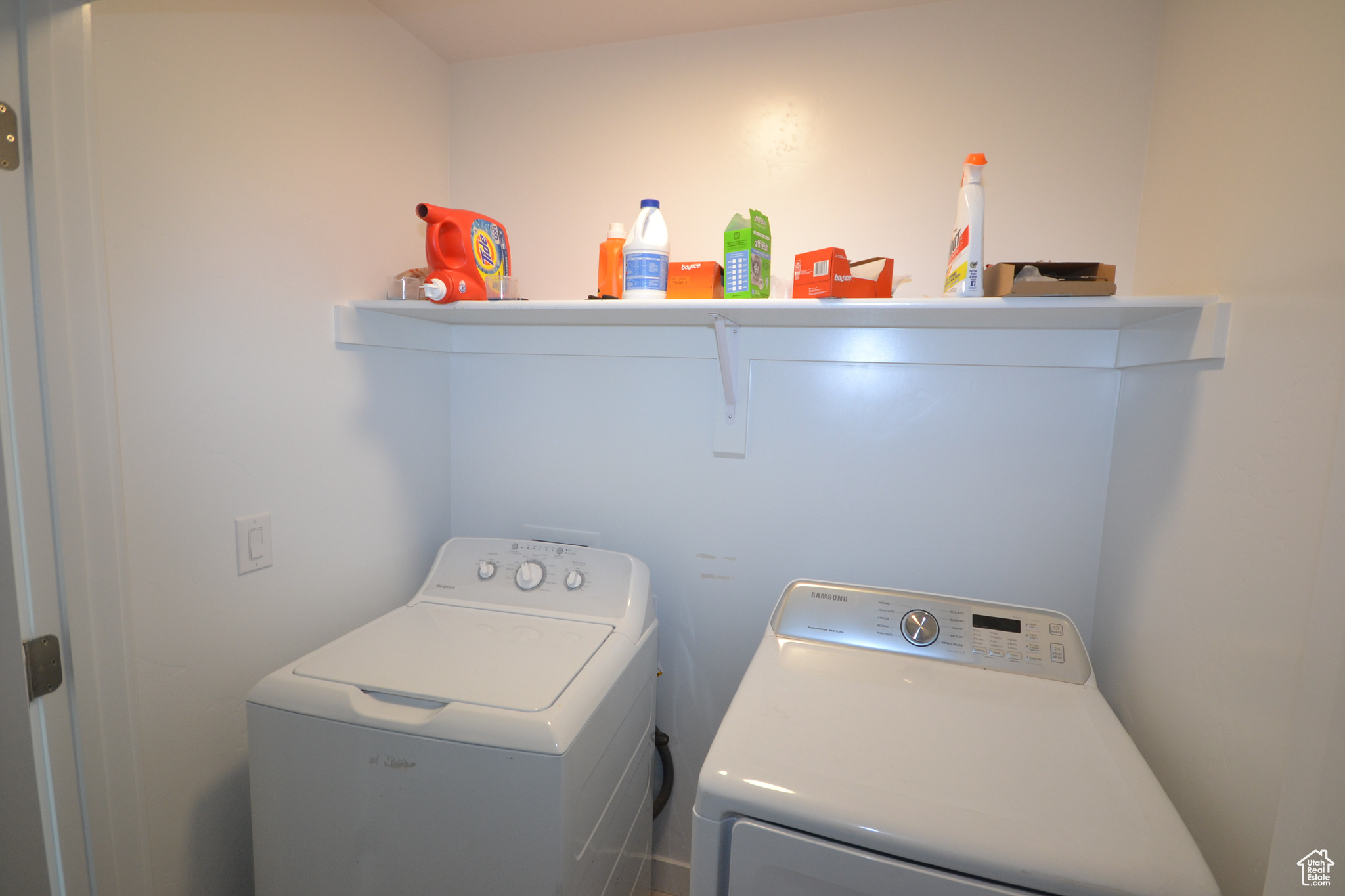 Laundry area with washing machine and clothes dryer
