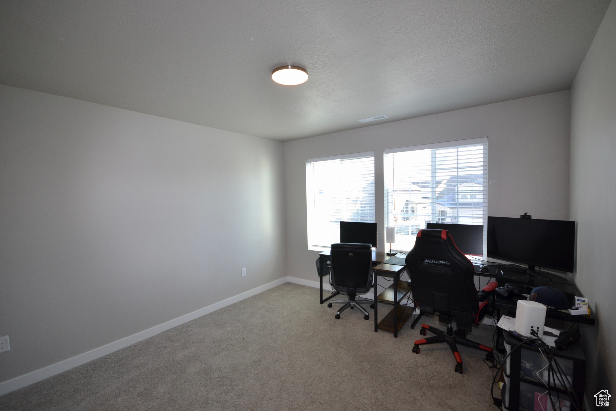 View of carpeted home office