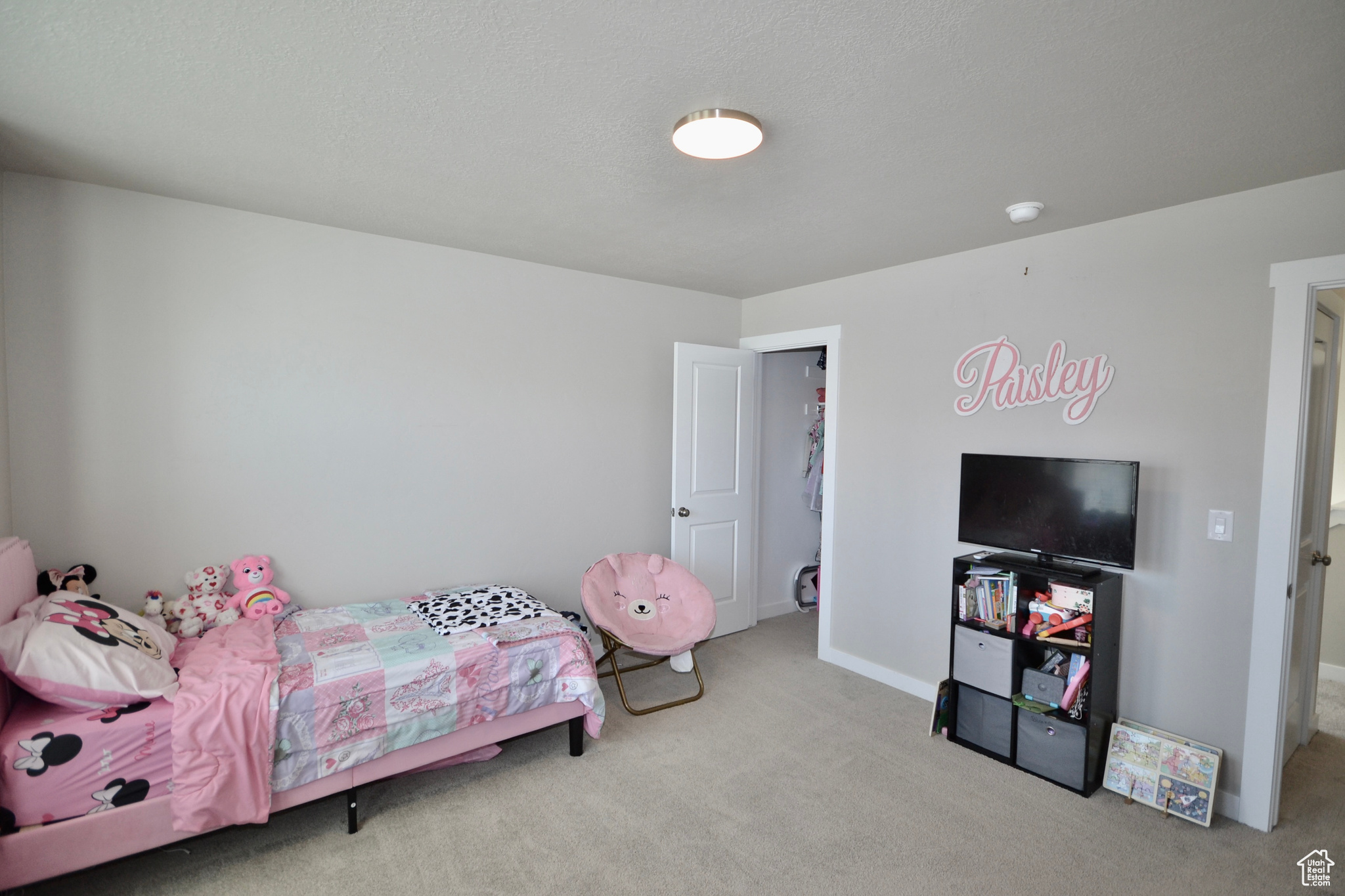 Bedroom with light colored carpet