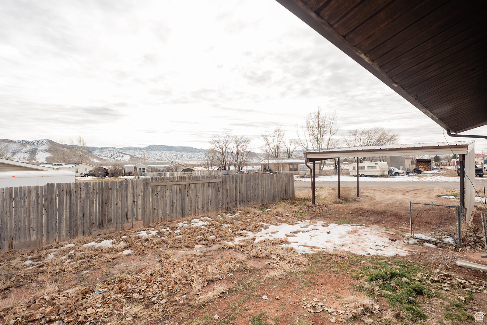 View of yard featuring a mountain view and a carport