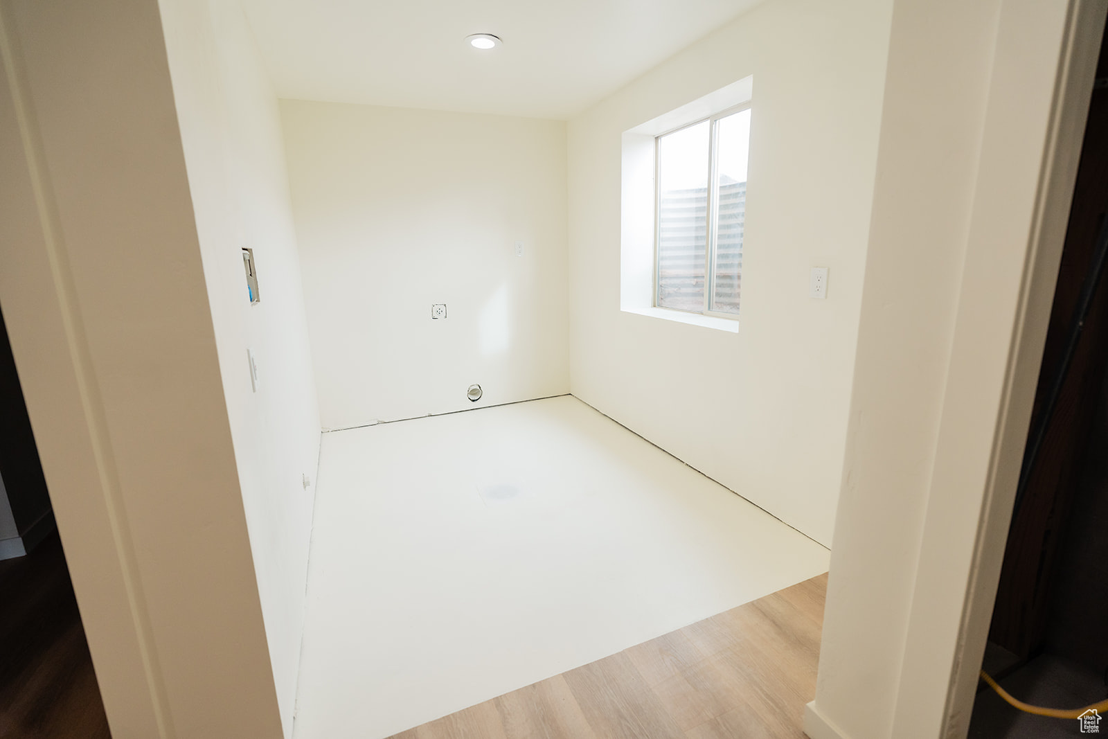 Unfurnished room with hardwood / wood-style floors