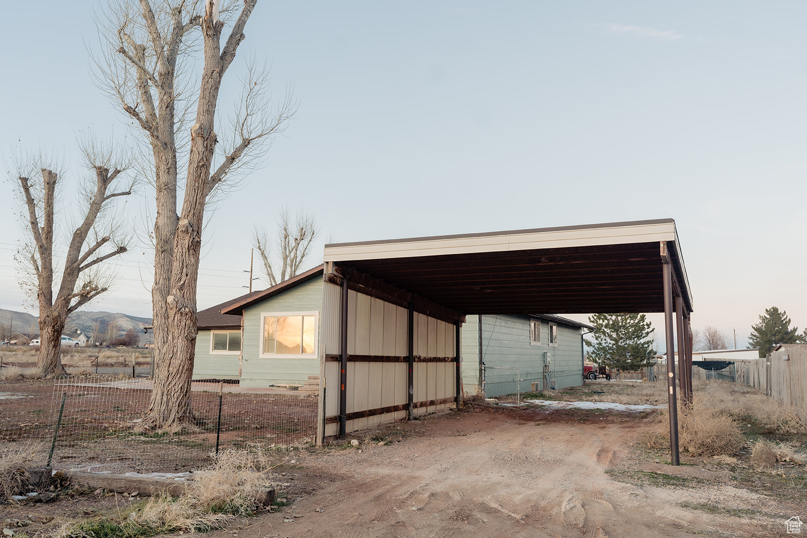Exterior space featuring a carport