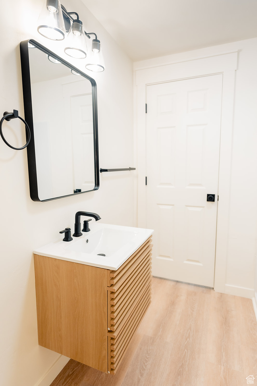 Bathroom with vanity and hardwood / wood-style floors