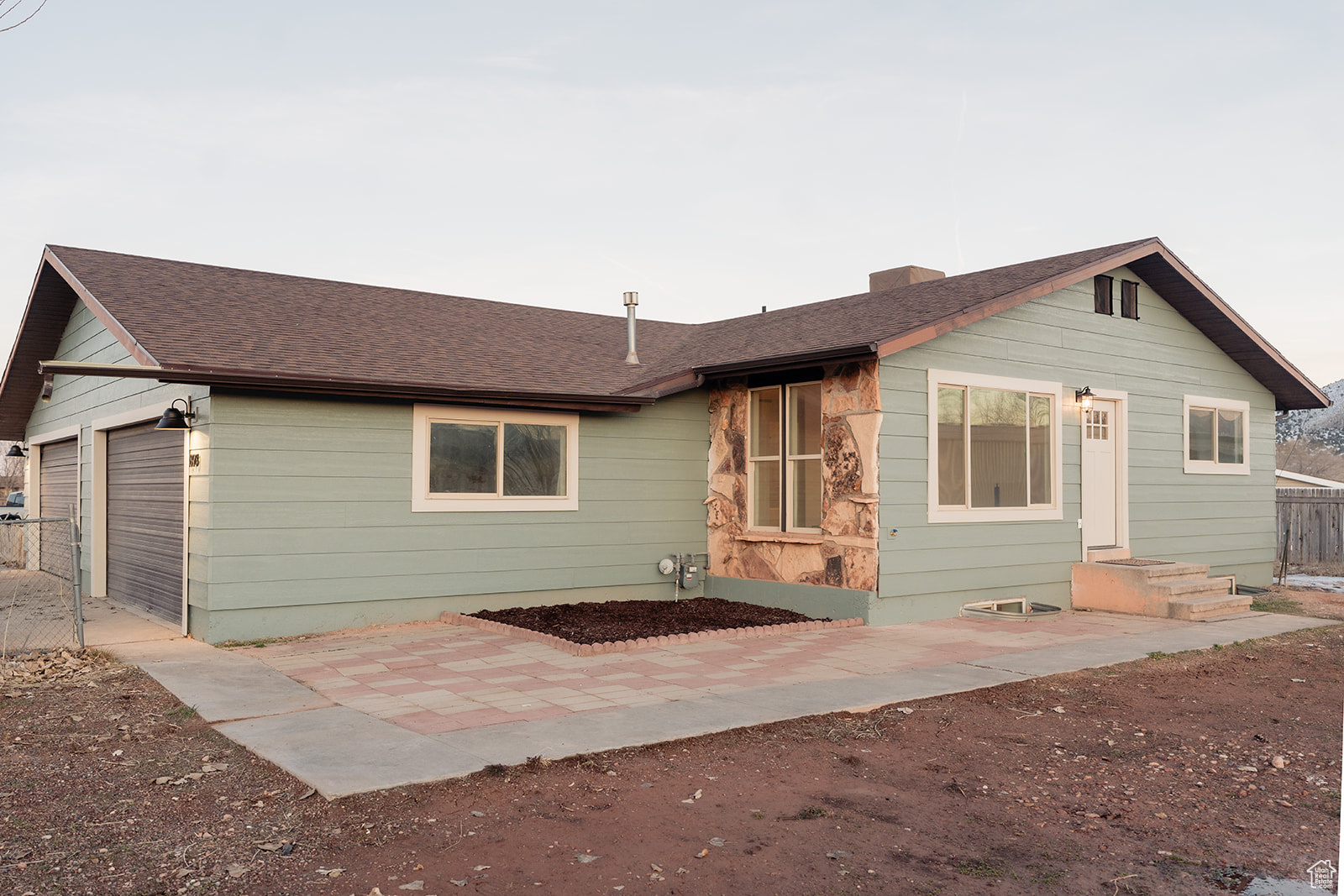 Rear view of house featuring a garage