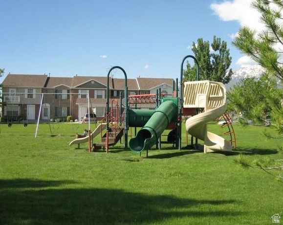View of playground featuring a yard