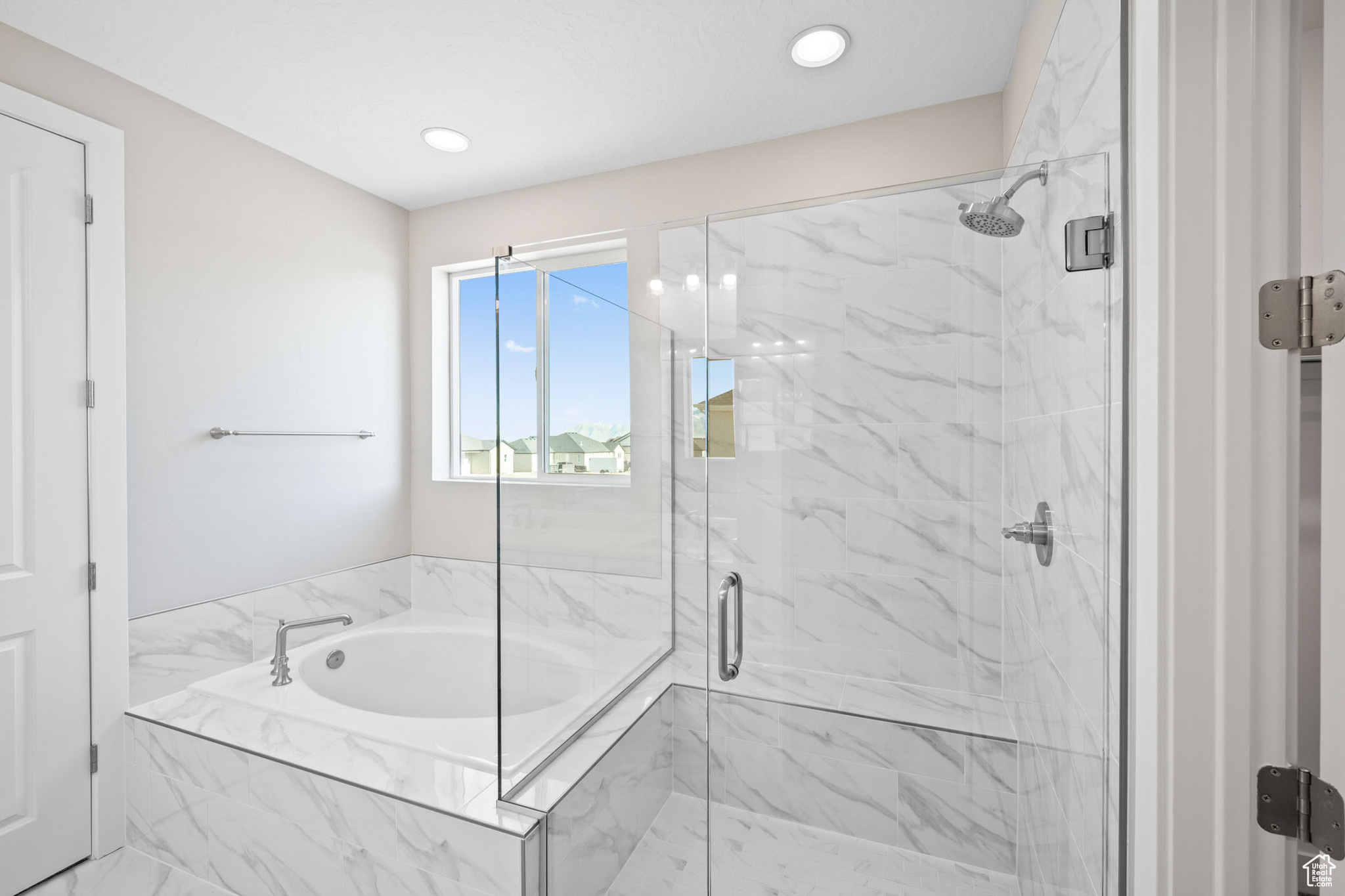 Bathroom featuring independent shower and bath