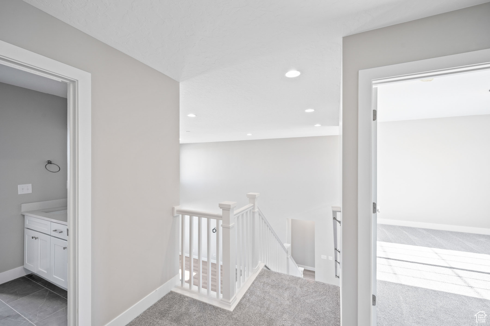Hall featuring carpet flooring