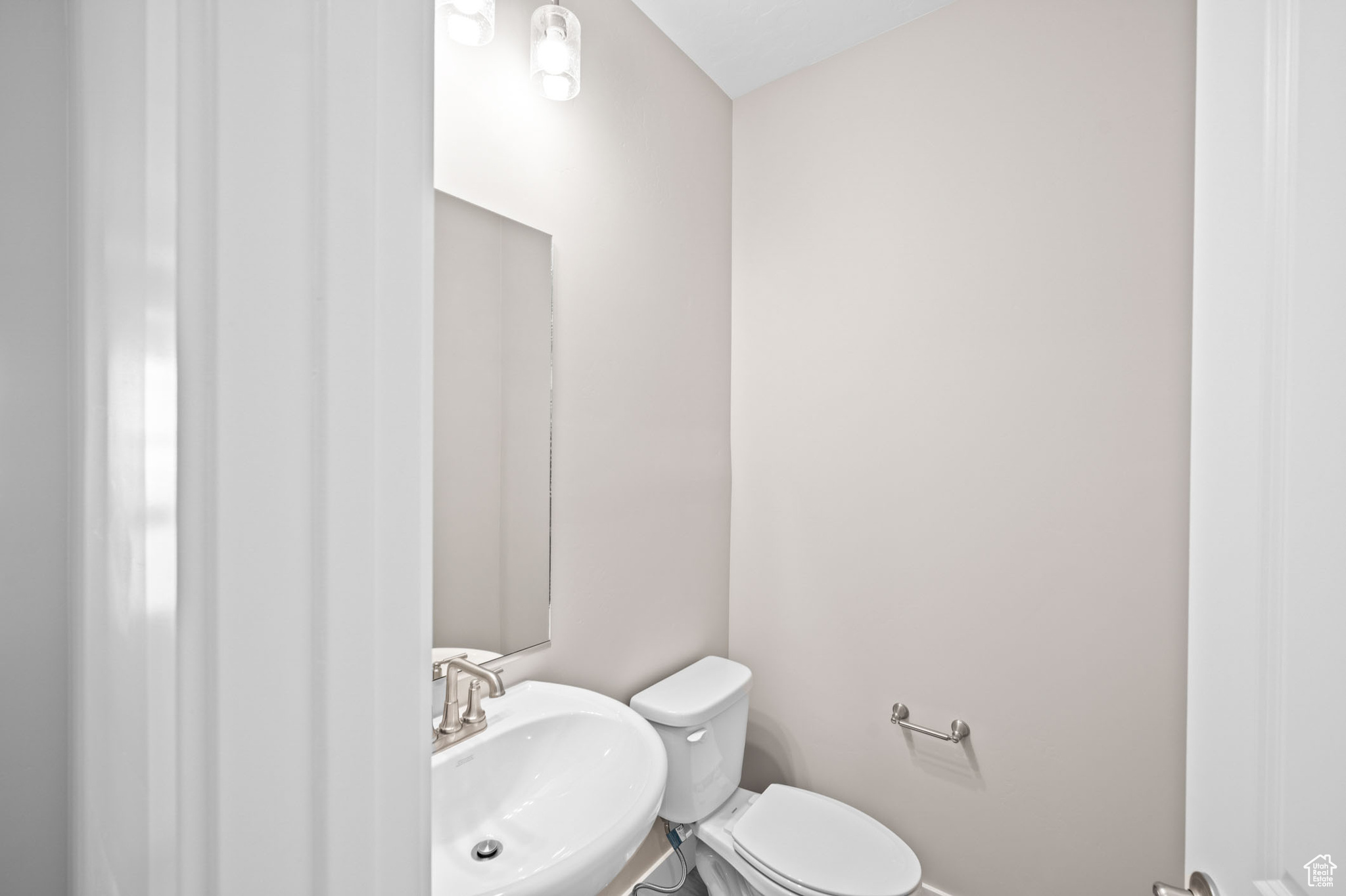 Bathroom featuring sink and toilet