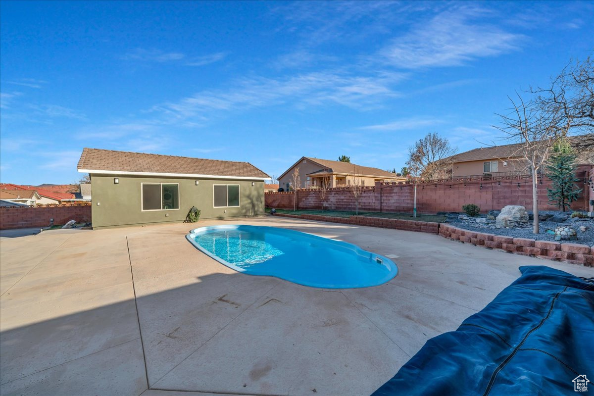 View of swimming pool with a patio