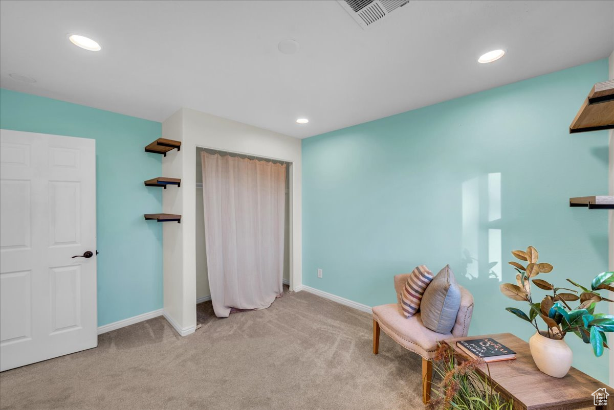 Unfurnished room featuring light carpet
