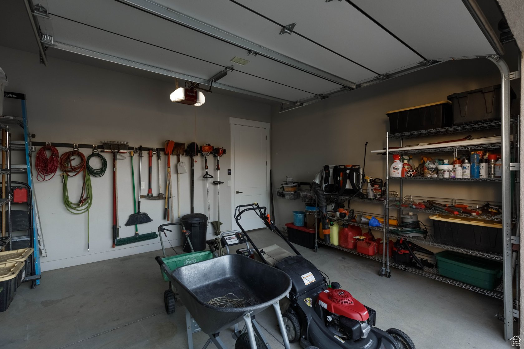 Garage featuring a garage door opener