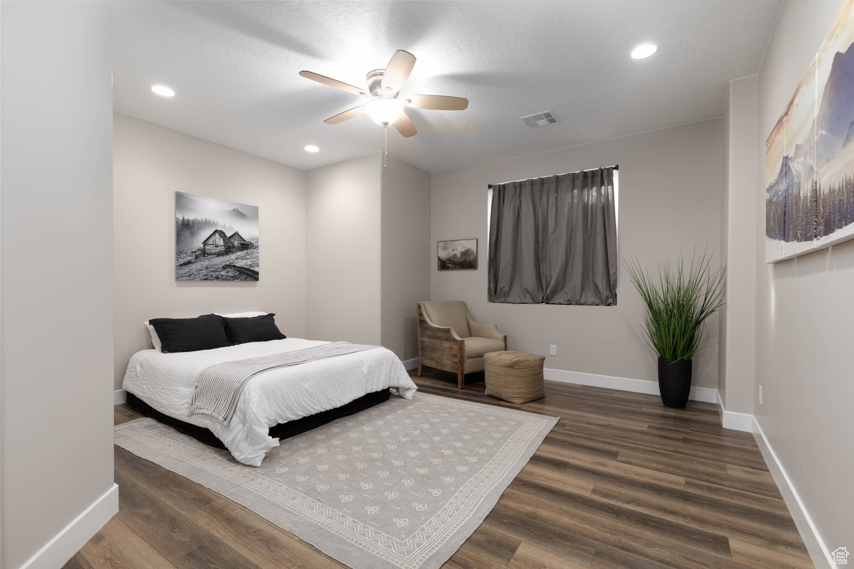 Bedroom with wood-type flooring and ceiling fan