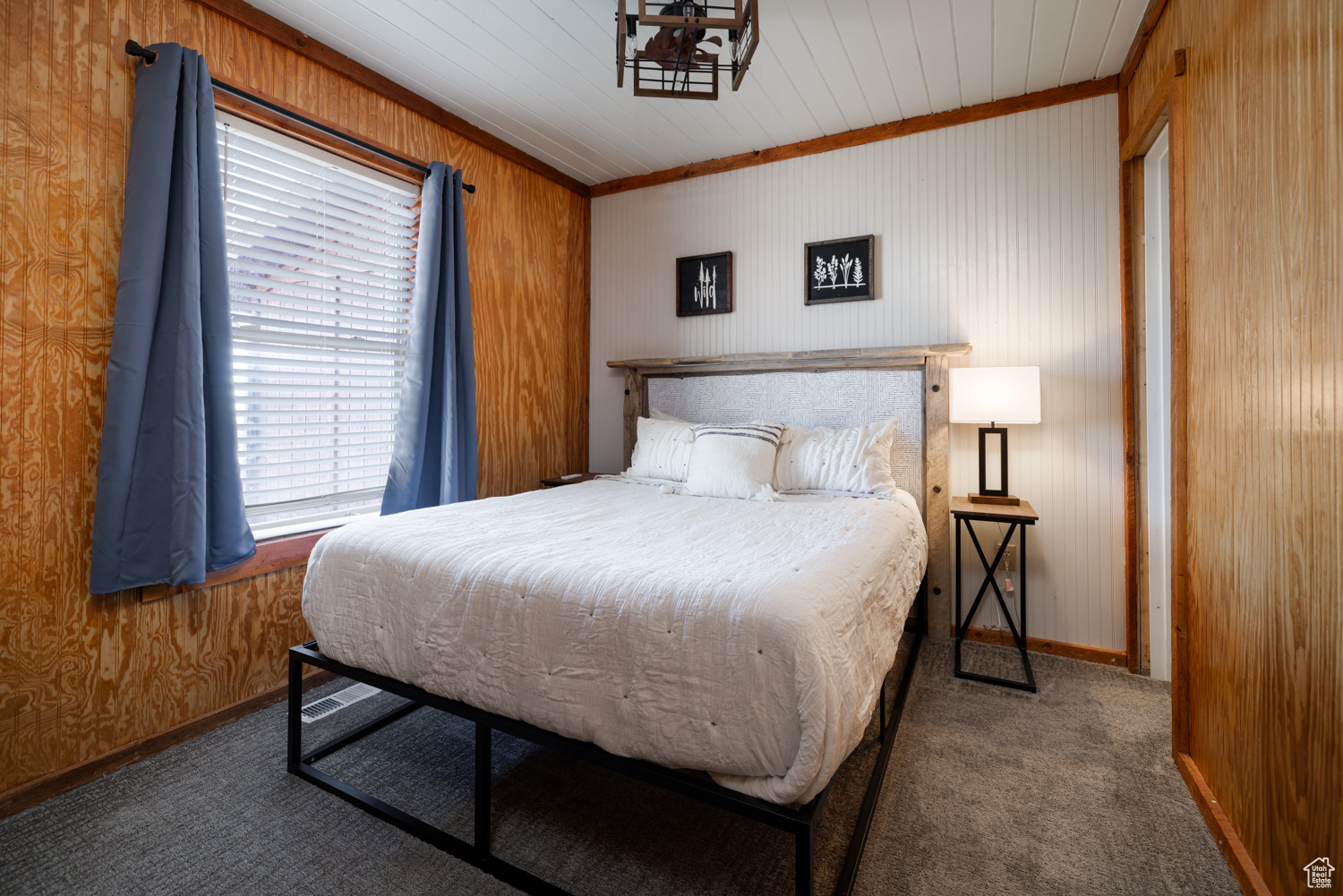 Bedroom featuring dark carpet
