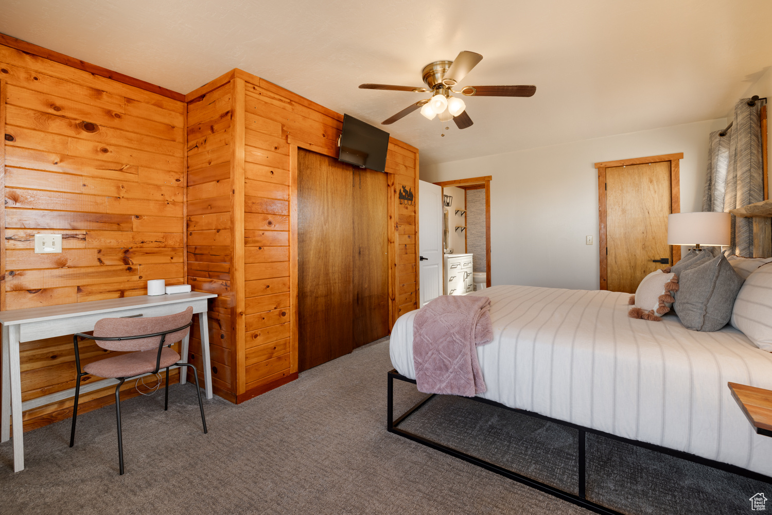 Bedroom with ceiling fan, a closet, and carpet