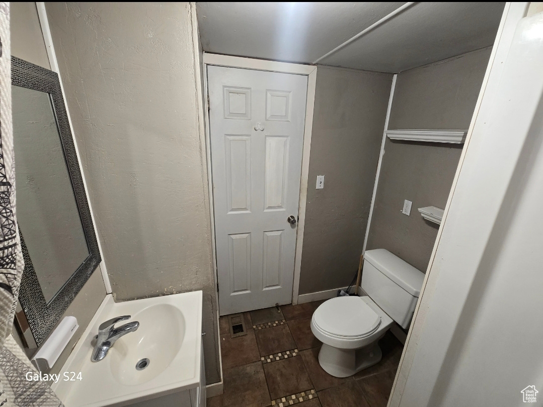 Bathroom with sink and toilet