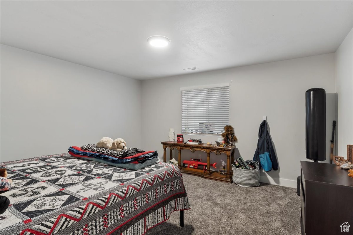 Bedroom with carpet