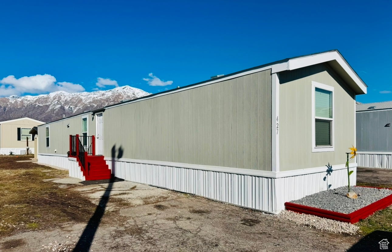 View of home's exterior with a mountain view