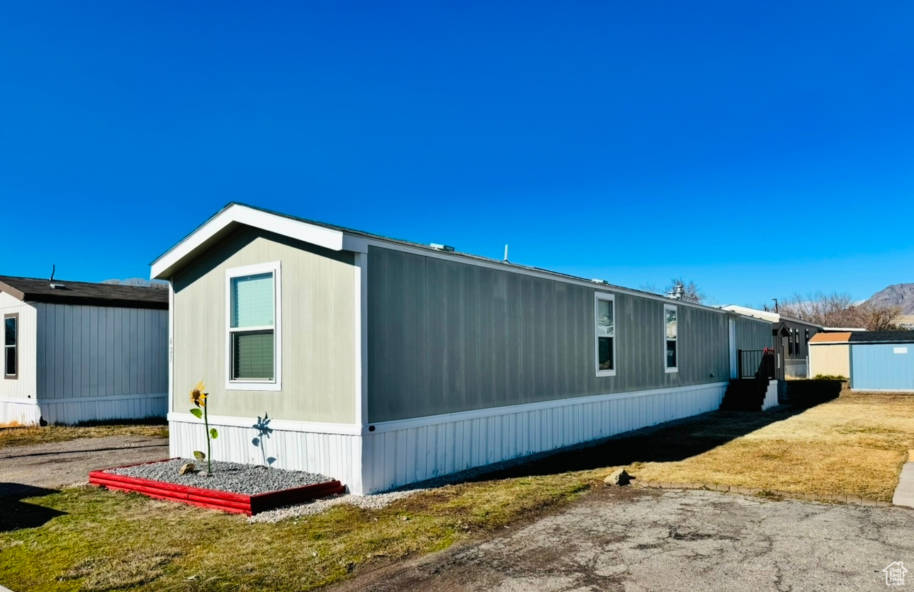 View of home's exterior featuring a yard