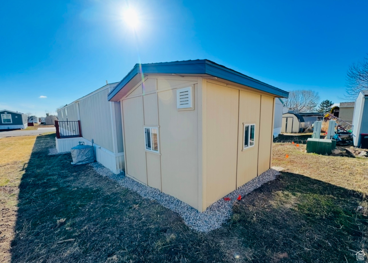 View of home's exterior featuring a yard