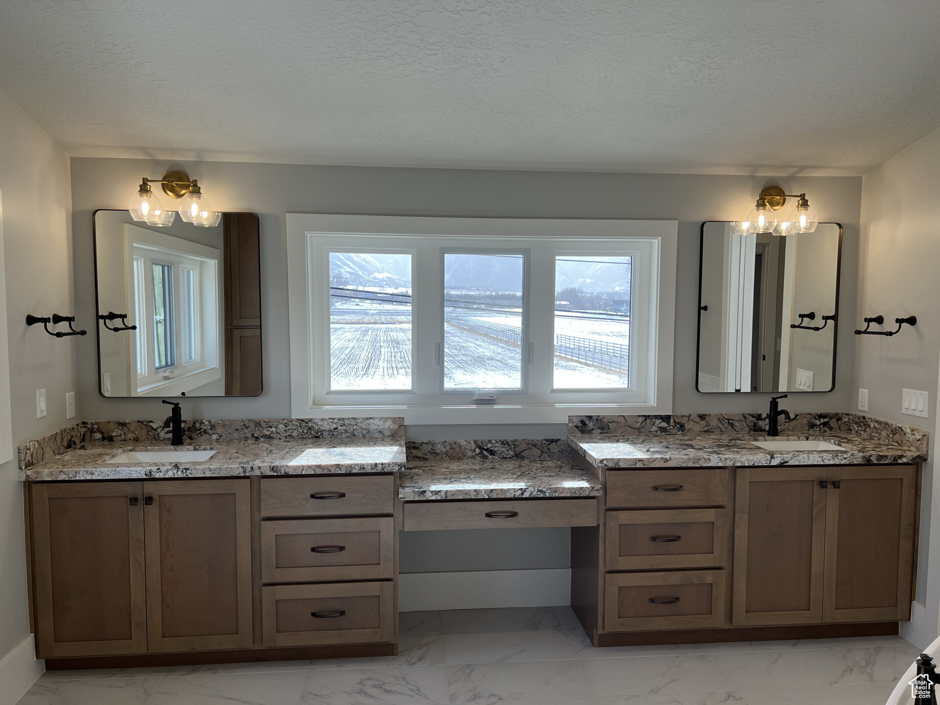 Bathroom with vanity and a textured ceiling