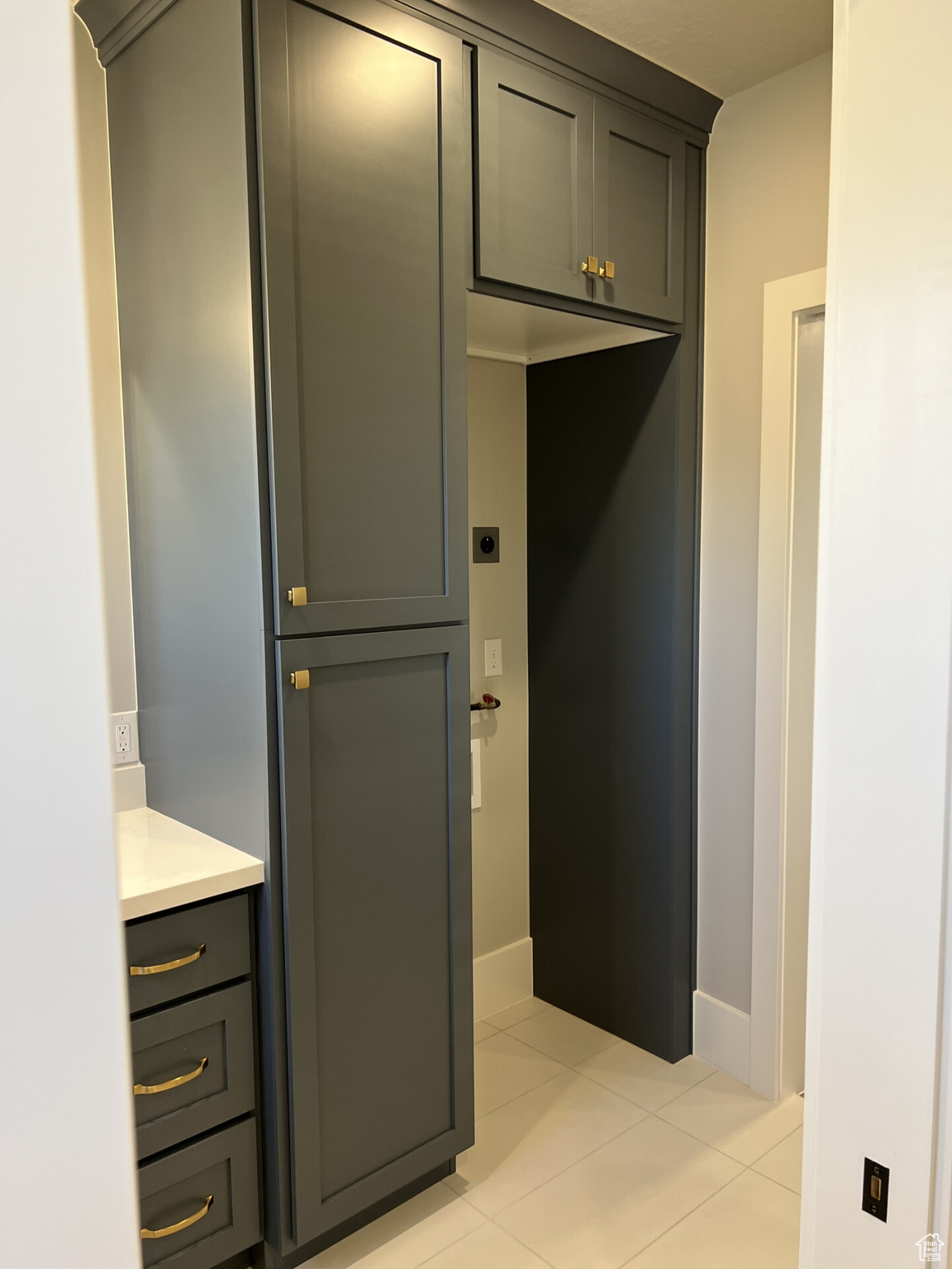 Interior space with tile patterned flooring and vanity