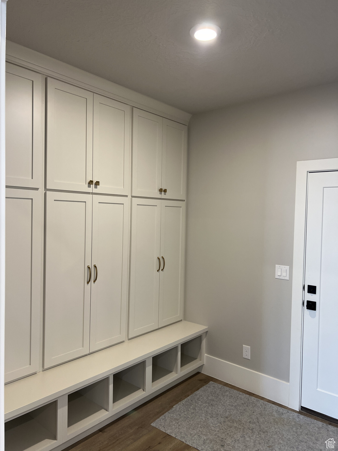 Mudroom with dark wood-type flooring