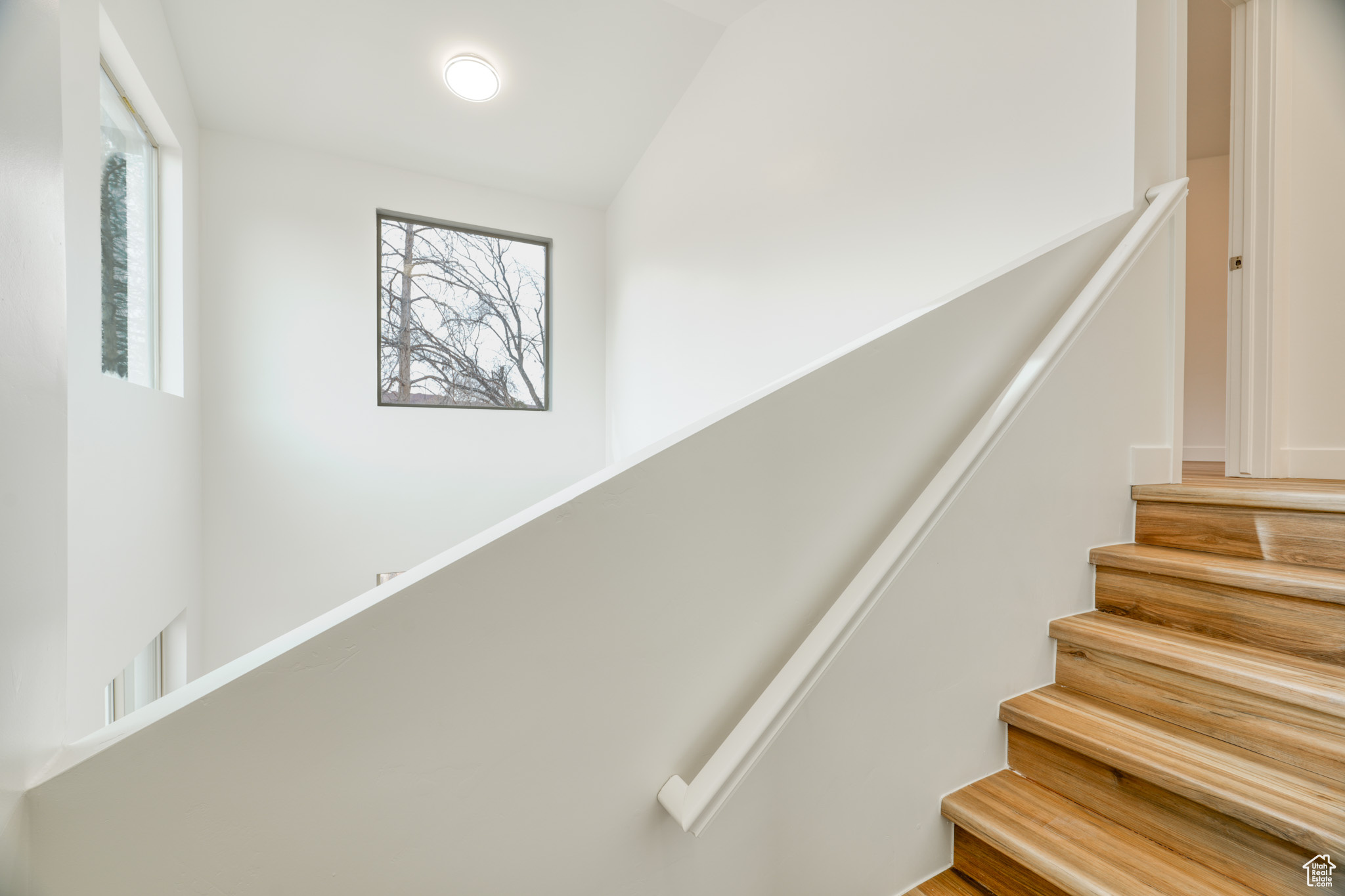 Staircase with vaulted ceiling