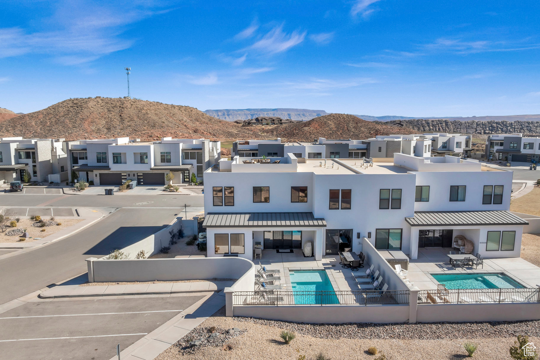 View of swimming pool with a patio and a mountain view