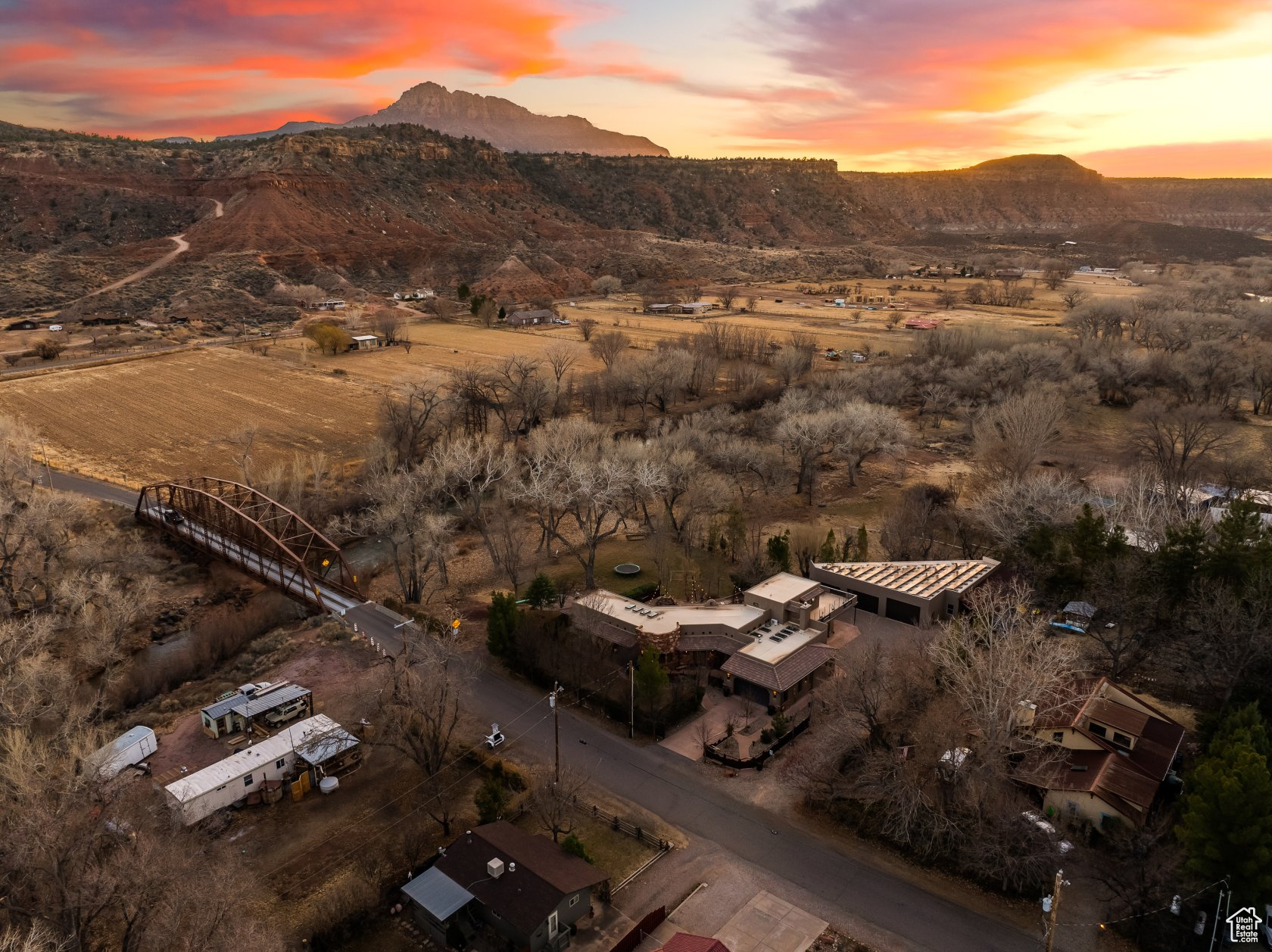 Aerial view at dusk featuring a mountain view