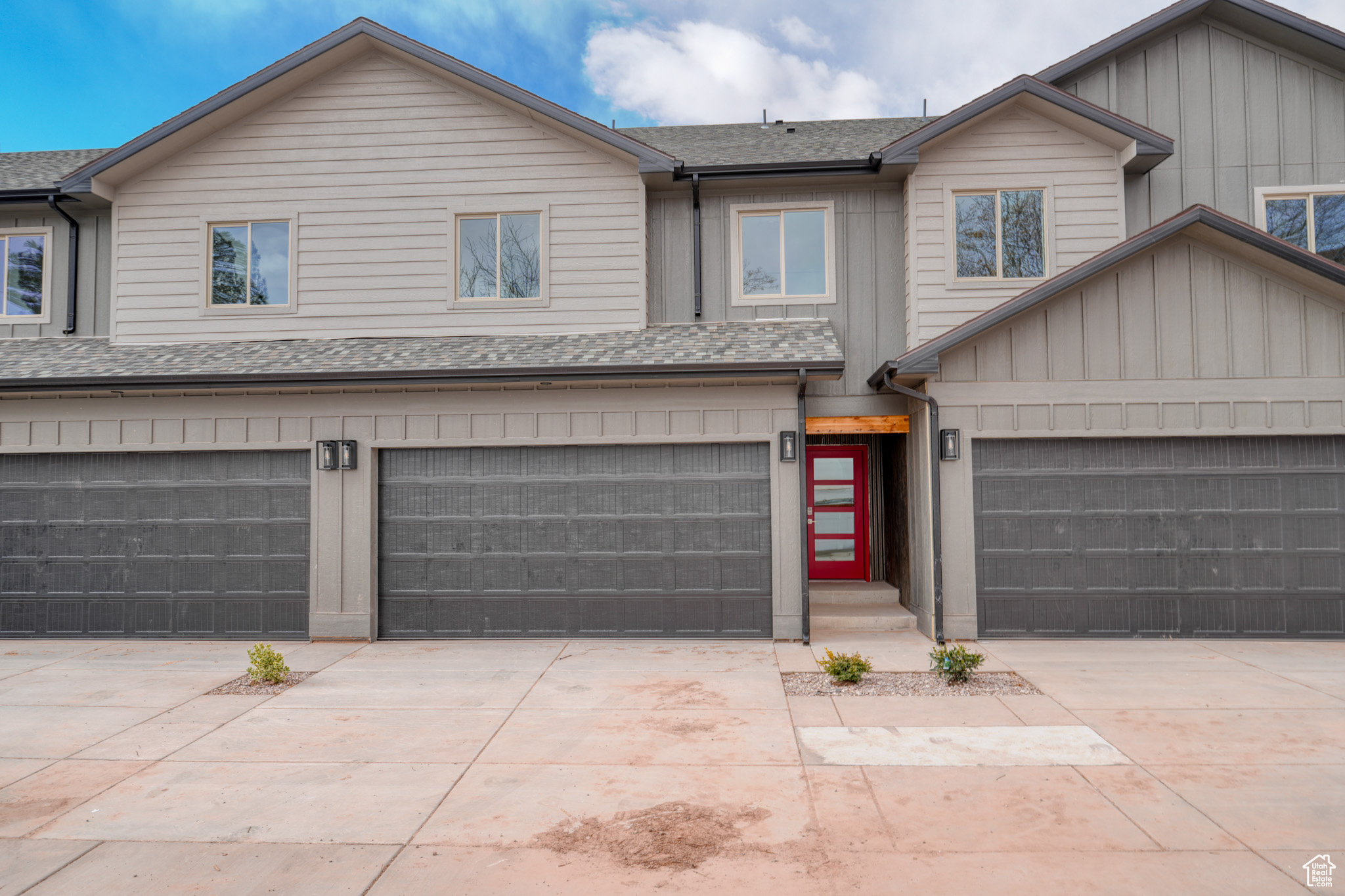 View of front facade featuring a garage