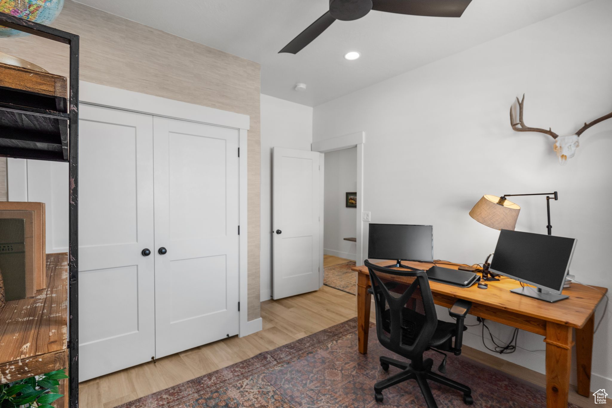 Office with ceiling fan and hardwood / wood-style floors