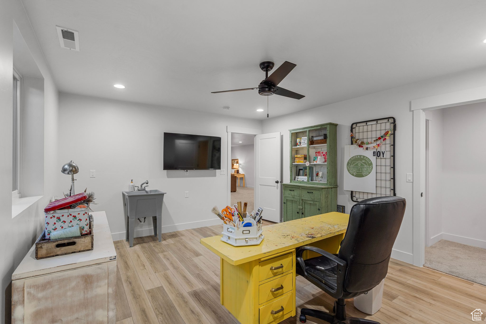 Office featuring ceiling fan and light wood-type flooring