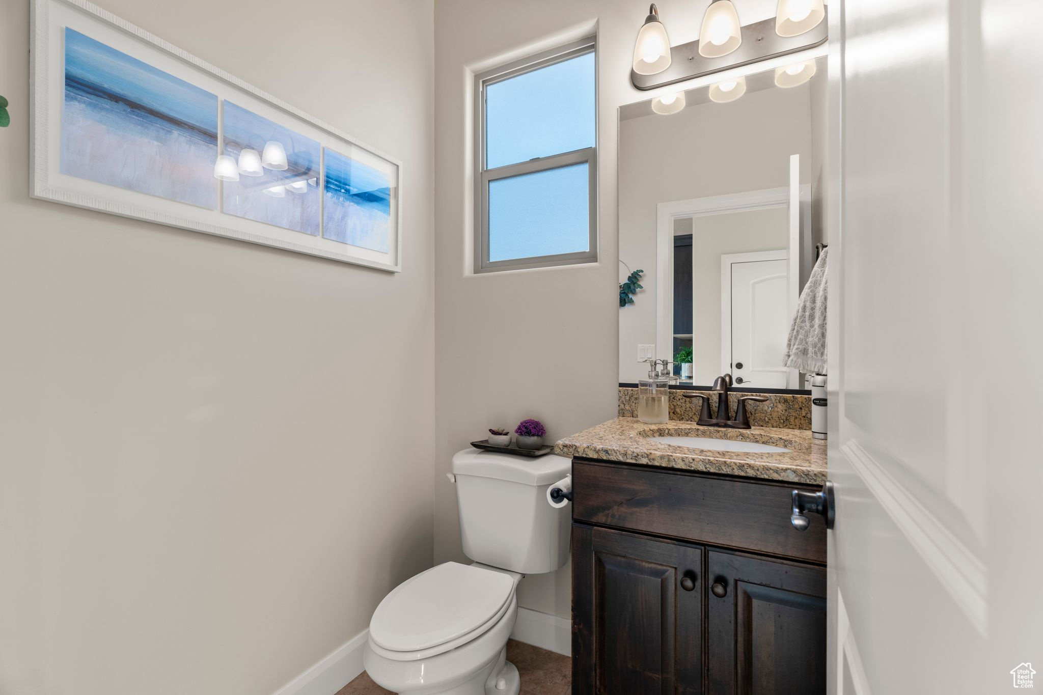 Bathroom with vanity and toilet