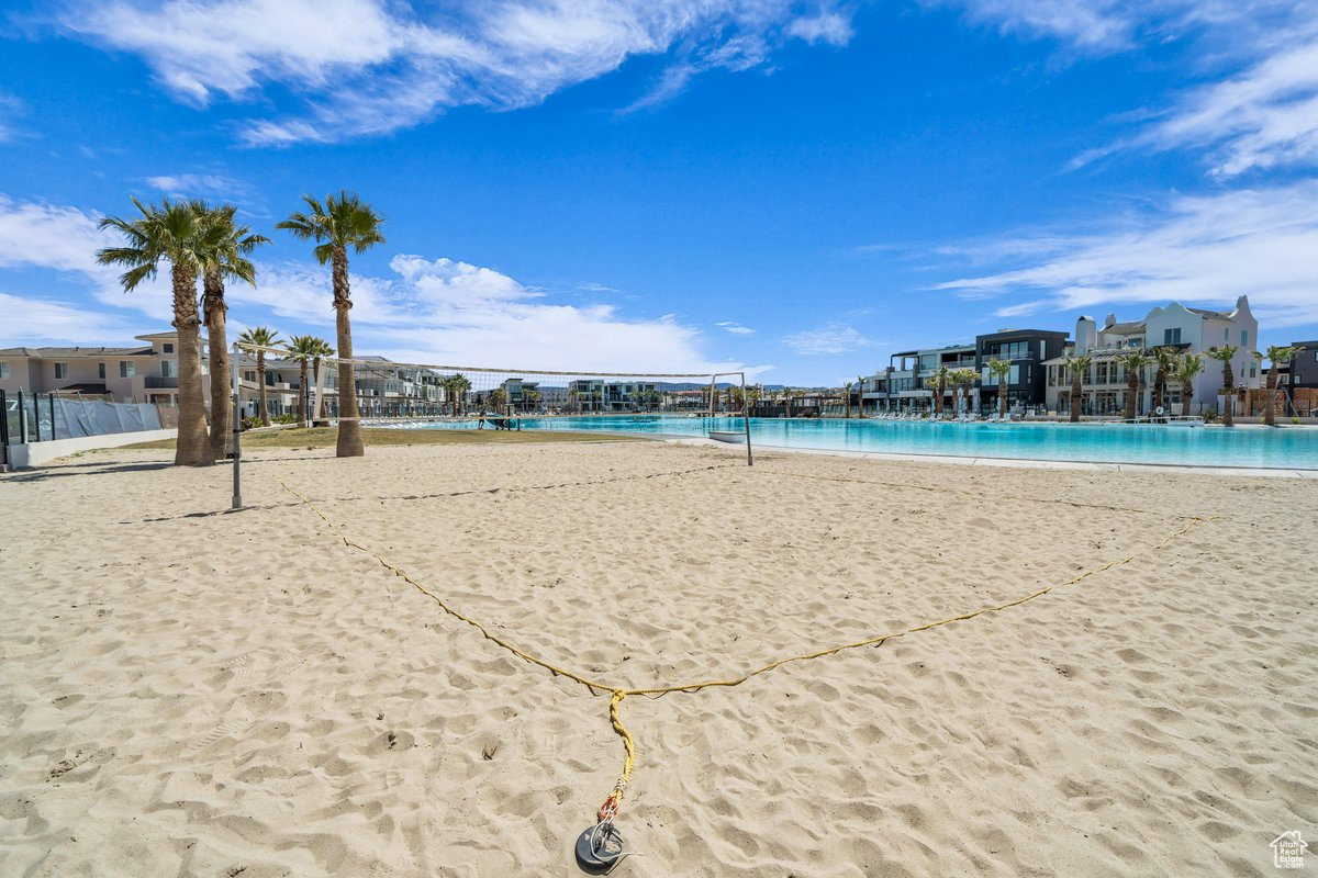 View of home's community featuring volleyball court