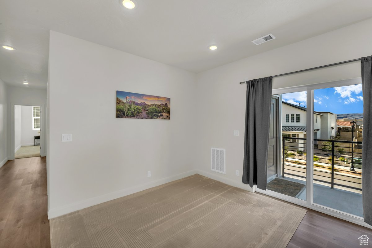 Unfurnished room featuring hardwood / wood-style floors