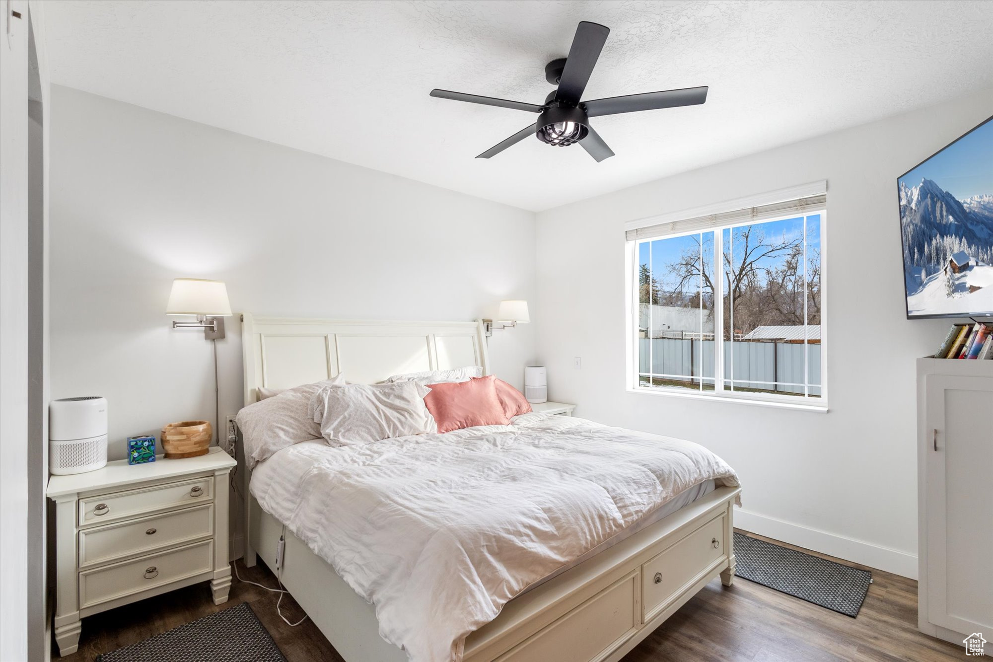 Primary Bedroom with ceiling fan and dark hardwood / wood-style flooring
