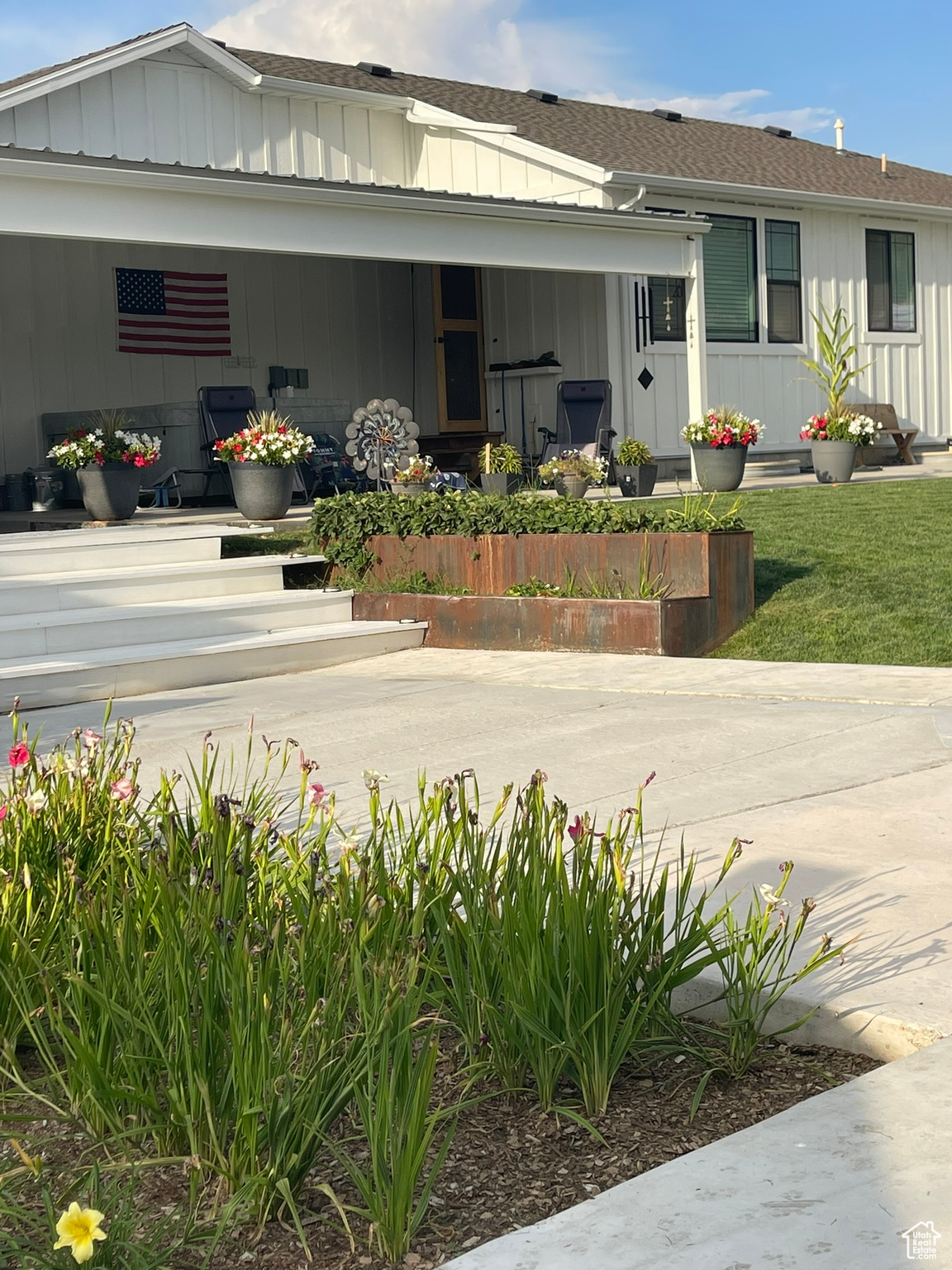Terraced Amphitheater and back covered patio in the summertime.