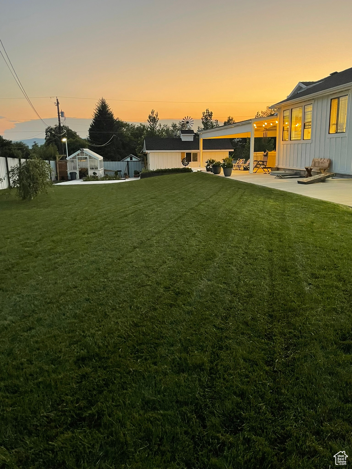 Summertime - Yard at dusk with a patio